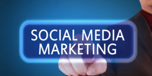 social media marketing in white letters over a blue background with a finger clicking the words