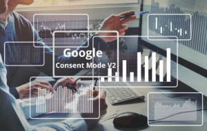 background image of business hand pointing at a screen with overlays of data charts with the words Google Consent Mode V2 in the middle